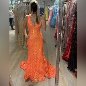 Orange jovani prom dress. Size 2. Only altered at shoulders. I love it.